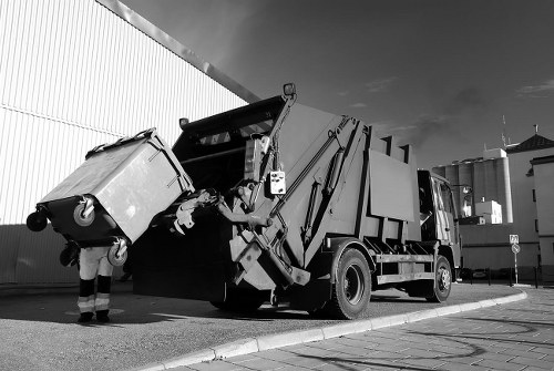 Vans lined up for rubbish collection in London street