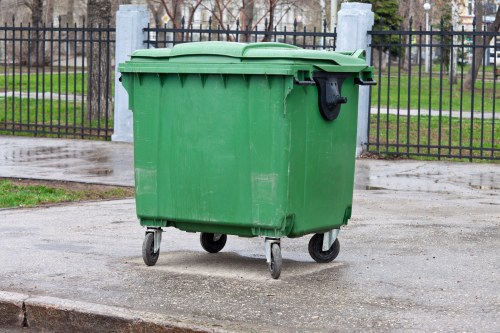 Workers loading waste from a flat for rubbish removal